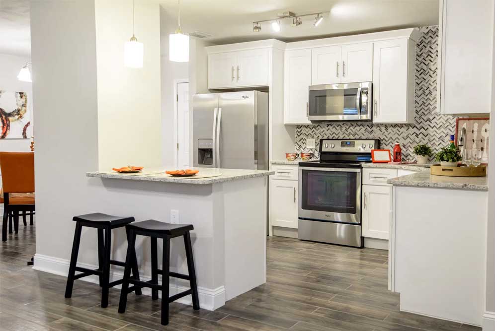 12x12-vs-10x10-kitchen-remodel-cost-comparison comparison of 12x12 vs 10x10 kitchen remodel costs with sample layouts