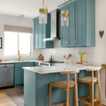 Teal Shaker-style Kitchen with White Quartz Island