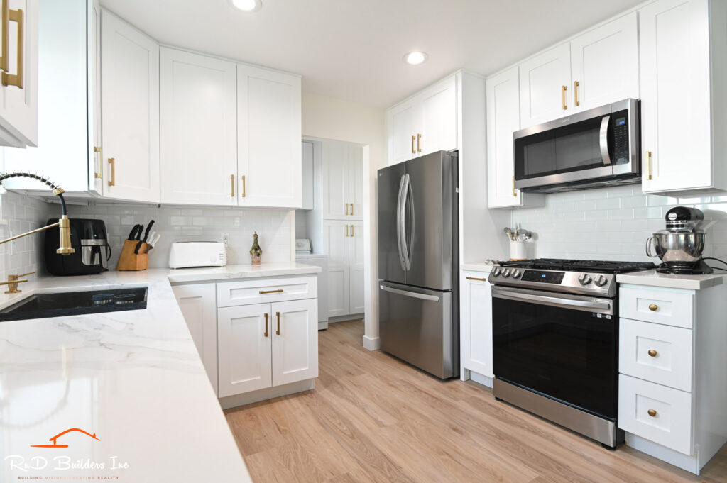 Thousand Oaks kitchen laundry: White shaker cabinet kitchen remodel with quartz countertops and stainless steel appliances in Thousand Oaks by RnD Builders Inc
