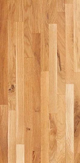 Close-up of natural oak hardwood flooring with warm honey tones and visible grain by RnD Builders Inc