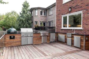 L-shaped Outdoor Kitchen with Stainless Steel Grill Discover the Best L-Shaped Outdoor Kitchen Designs for 2026