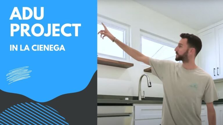 Video thumbnail showing man pointing in ADU kitchen with white shaker cabinets and brushed nickel faucet by RnD Builders Inc