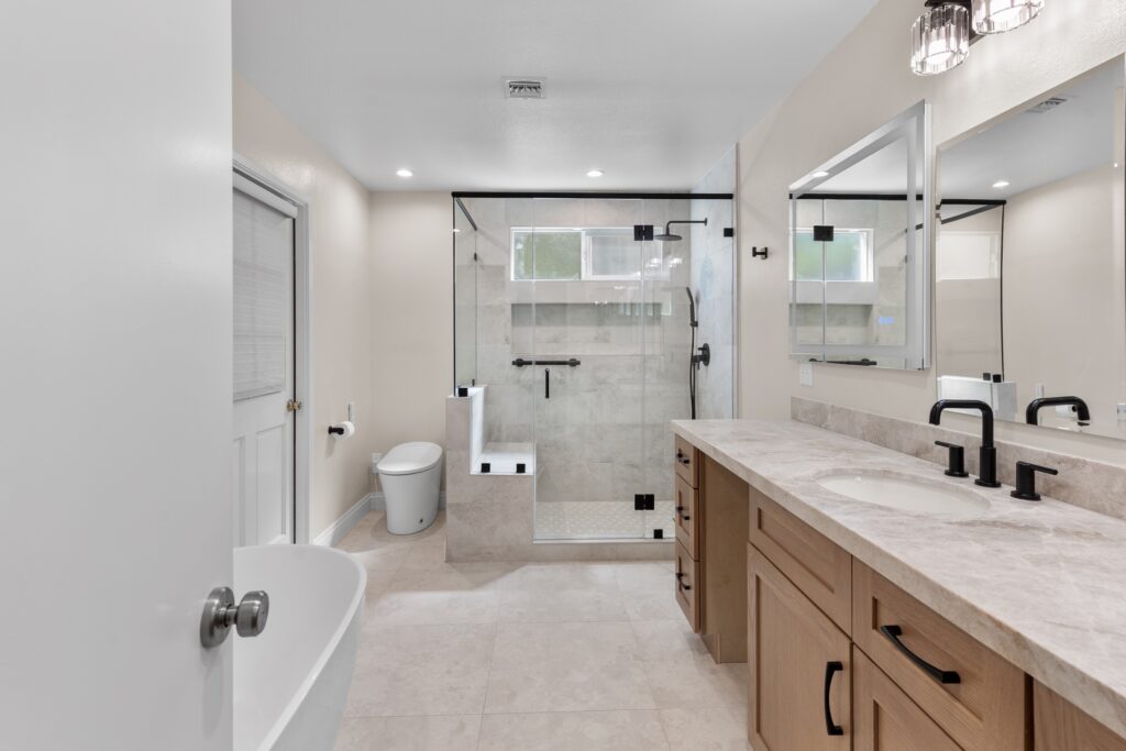 Spa-style Master Bathroom with Glass Walk-in Shower in Thousand Oaks Thousand Oaks full remodel: Spa-style master bathroom with glass walk-in shower, dual vanity, and freestanding soaking tub in Thousand Oaks by RnD Builders Inc