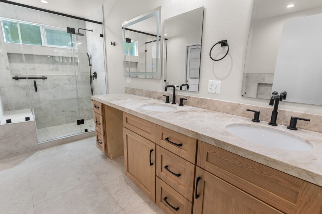 Master Bathroom with Double Vanity in Thousand Oaks Bathroom remodeling with a natural wood double vanity and walk-in shower by RnD Builders in Ventura County