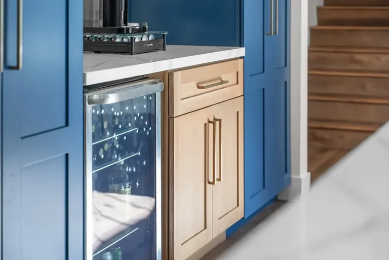 Blue and natural wood shaker cabinets with wine fridge and white quartz countertop in Thousand Oaks by RnD Builders Inc