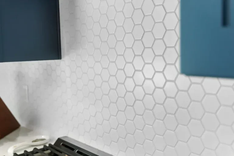 Thousand Oaks home transformation: White hexagon mosaic tile kitchen backsplash with teal blue cabinets in Thousand Oaks by RnD Builders Inc