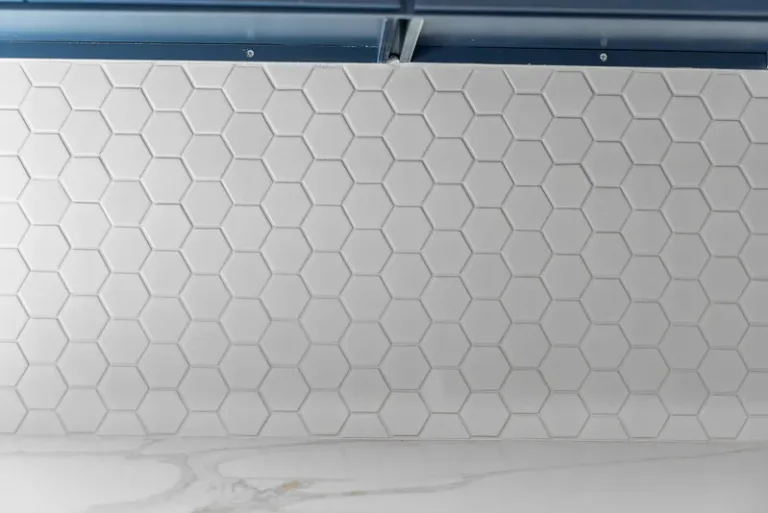 Thousand Oaks home transformation: White hexagon mosaic tile backsplash above marble-look quartz countertop in Thousand Oaks by RnD Builders Inc