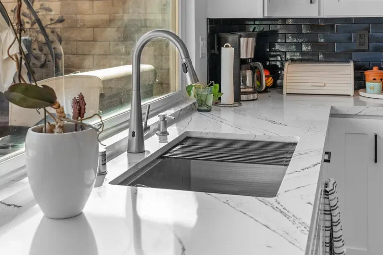 White marble quartz countertop with undermount stainless steel sink and pull-down faucet in Moorpark by RnD Builders Inc