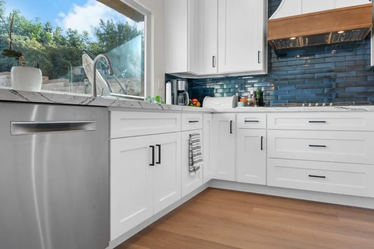 White shaker kitchen with blue subway tile backsplash and marble quartz countertops in Moorpark by RnD Builders Inc
