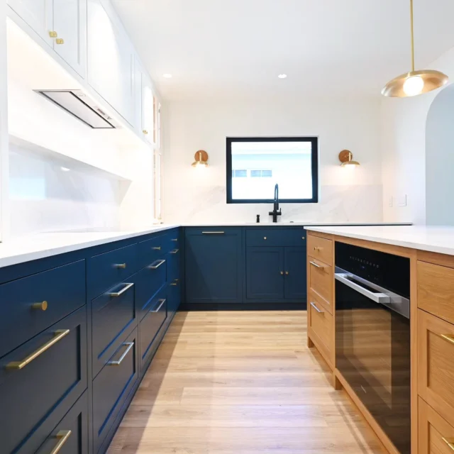 Navy Blue Shaker Lower Cabinets with Brass Hardware Completed home remodel by RnD Builders