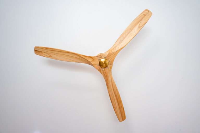 ADU Ceiling Fan Close-up with a wood three-blade fan against a white ceiling in Simi Valley by RnD Builders Inc