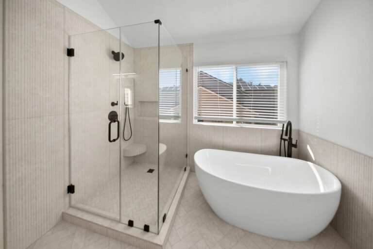 Luxury Master Bathroom with Freestanding Soaking Tub Luxury master bathroom with freestanding soaking tub and frameless glass shower enclosure by RnD Builders Inc