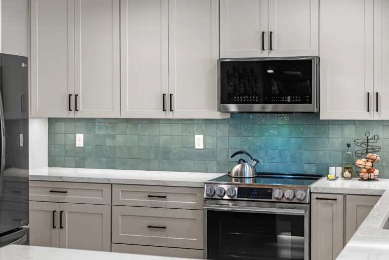 Thousand Oaks kitchen remodel: Range Wall with Teal Tile Backsplash in Thousand Oaks by RnD Builders Inc