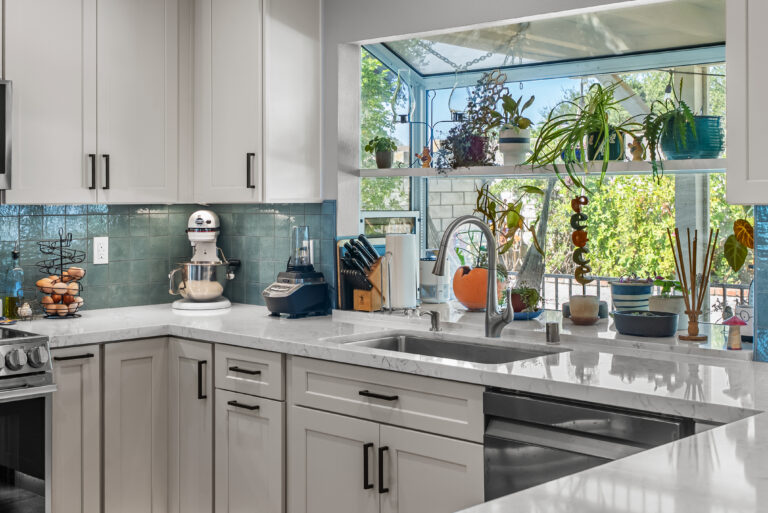 Garden Window with Plants Above the Sink with a garden window in Thousand Oaks by RnD Builders Inc
