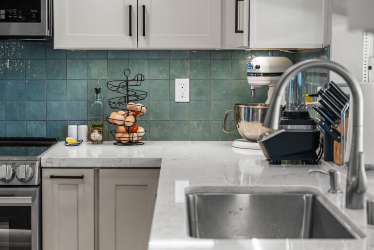 Sink Corner with Faucet and Teal Tile with a stainless sink in Thousand Oaks by RnD Builders Inc