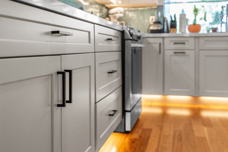 Lower Cabinet Run Beside the Range with gray shaker base cabinets in Thousand Oaks by RnD Builders Inc