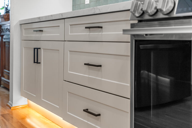 Thousand Oaks kitchen remodel: Drawer Stack with Black Pulls and Toe-Kick Lighting in Thousand Oaks by RnD Builders Inc