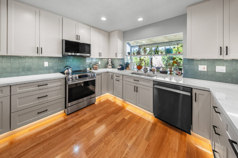 Thousand Oaks kitchen remodel: Finished Kitchen with Sink Window and Hardwood Floors in Thousand Oaks by RnD Builders Inc