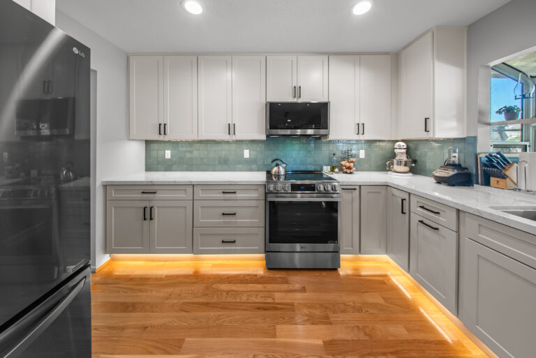 Thousand Oaks kitchen remodel: Range Wall and Refrigerator with Hardwood Floor in Thousand Oaks by RnD Builders Inc